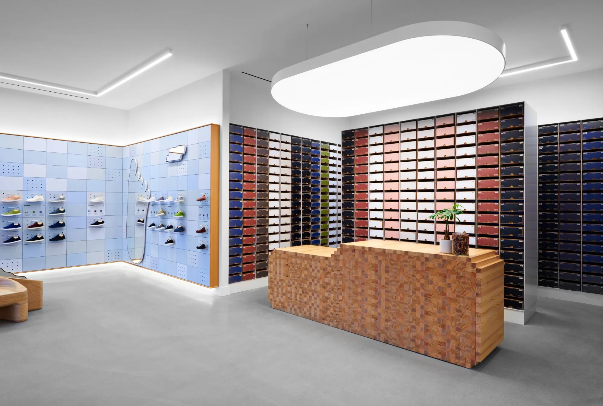 Allbirds store checkout counter and shoe box wall